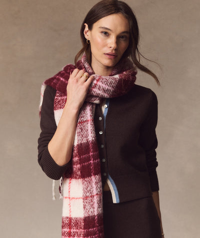 Model wearing a pink and burgundy plaid Brushed Scarf over a brown cardigan against a neutral background.