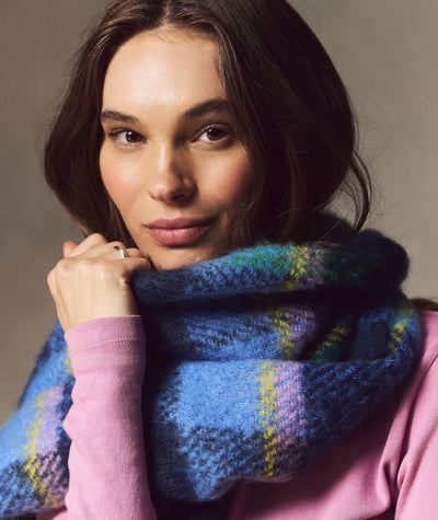 Model wearing a blue, yellow, and pink plaid Brushed Scarf, close-up view.