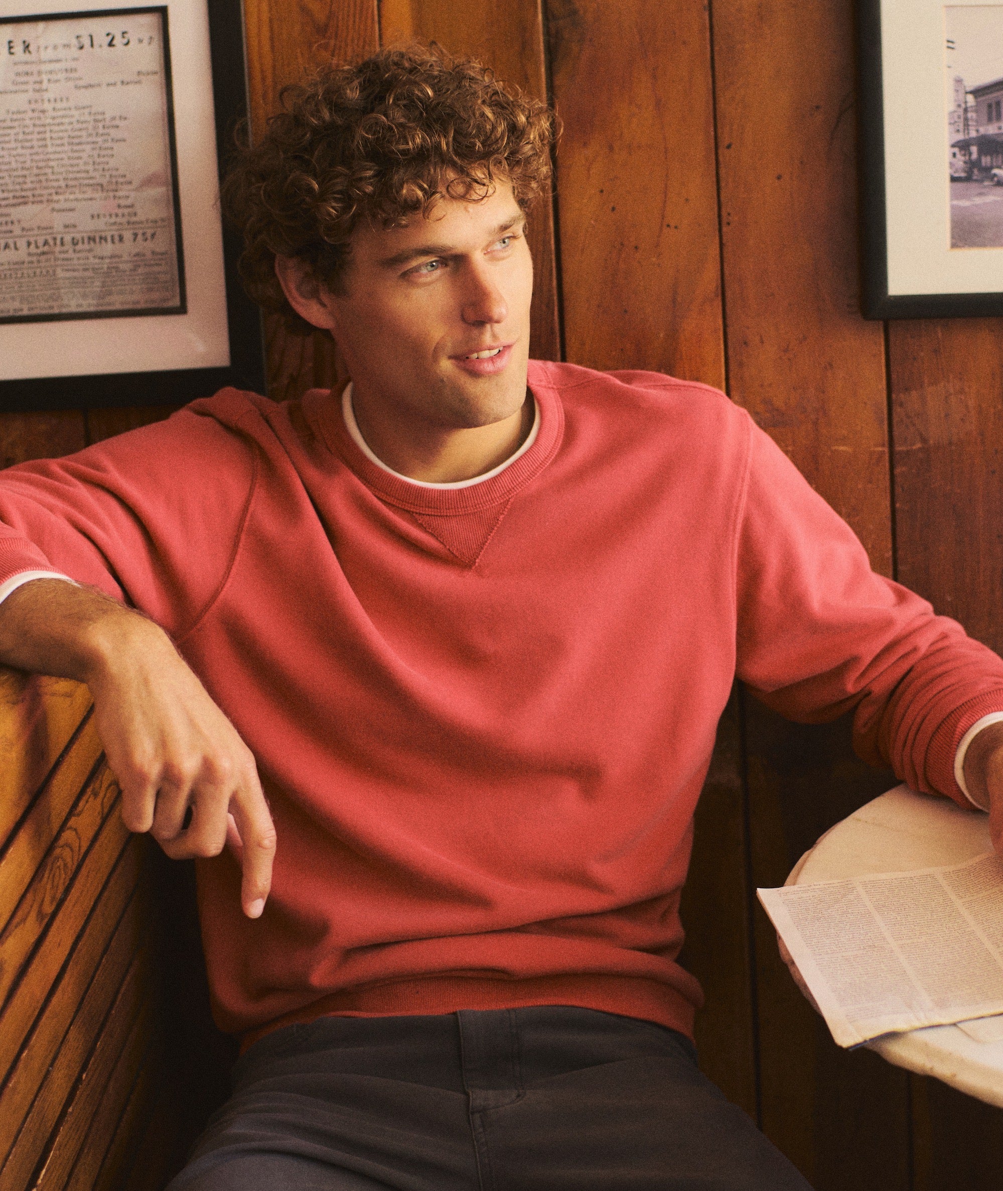 A dusty rose pink super soft crewneck sweatshirt laid flat against a neutral light gray background with full length sleeves