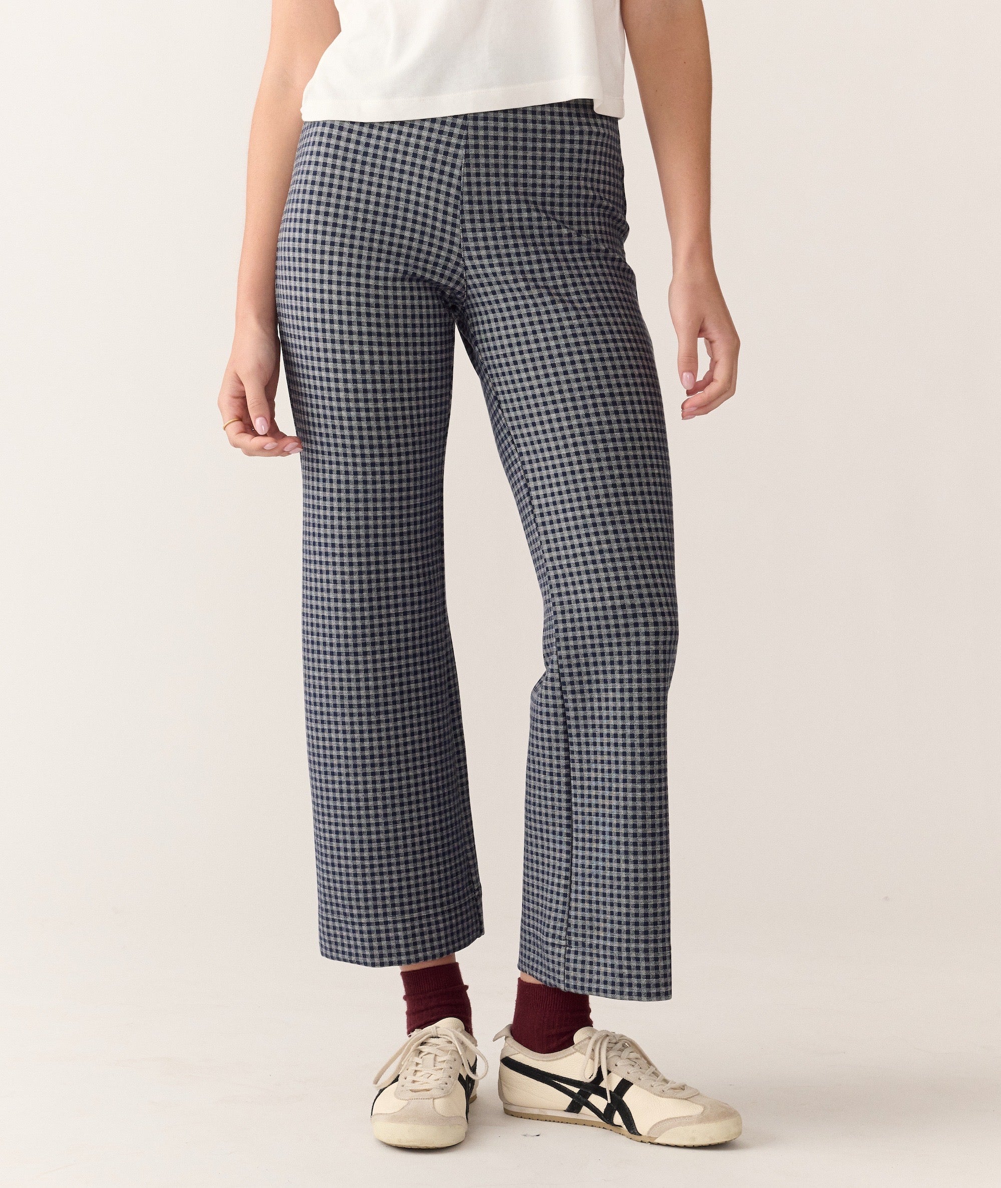 Model wearing blue and white gingham Bobbi Flare Pant, cropped length, front view, isolated on white.