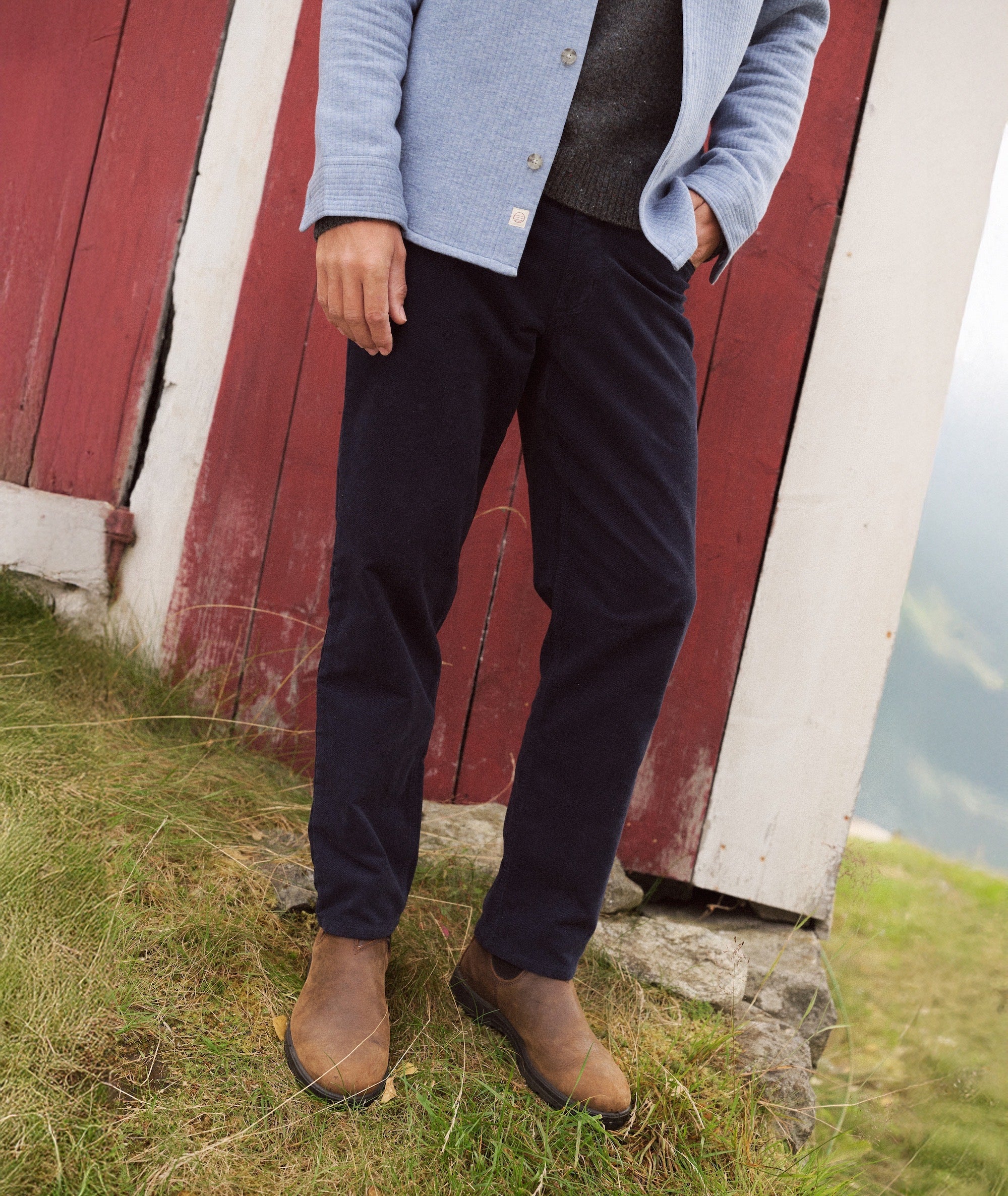 Flex Terry Moleskin Pant - Slim Straight in navy worn with a light blue jacket and brown boots.