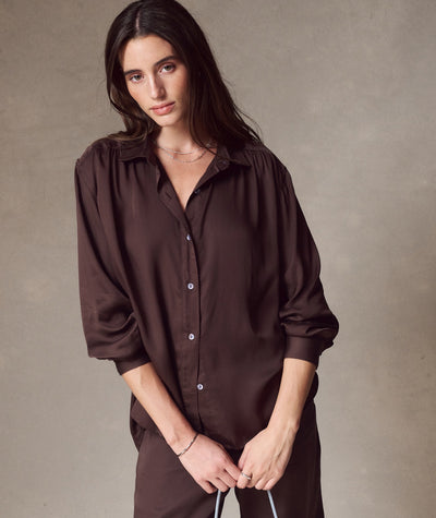 Model wearing the chocolate brown Bella Better-than-Silk Button Down, front view with loose fit.