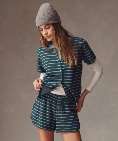 Model wearing a Double Knit Short in green and blue stripes, styled with a matching button-down top.
